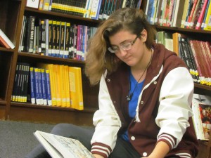 Hannah Merritt, senior at LCHS, concentrates on her book. 
